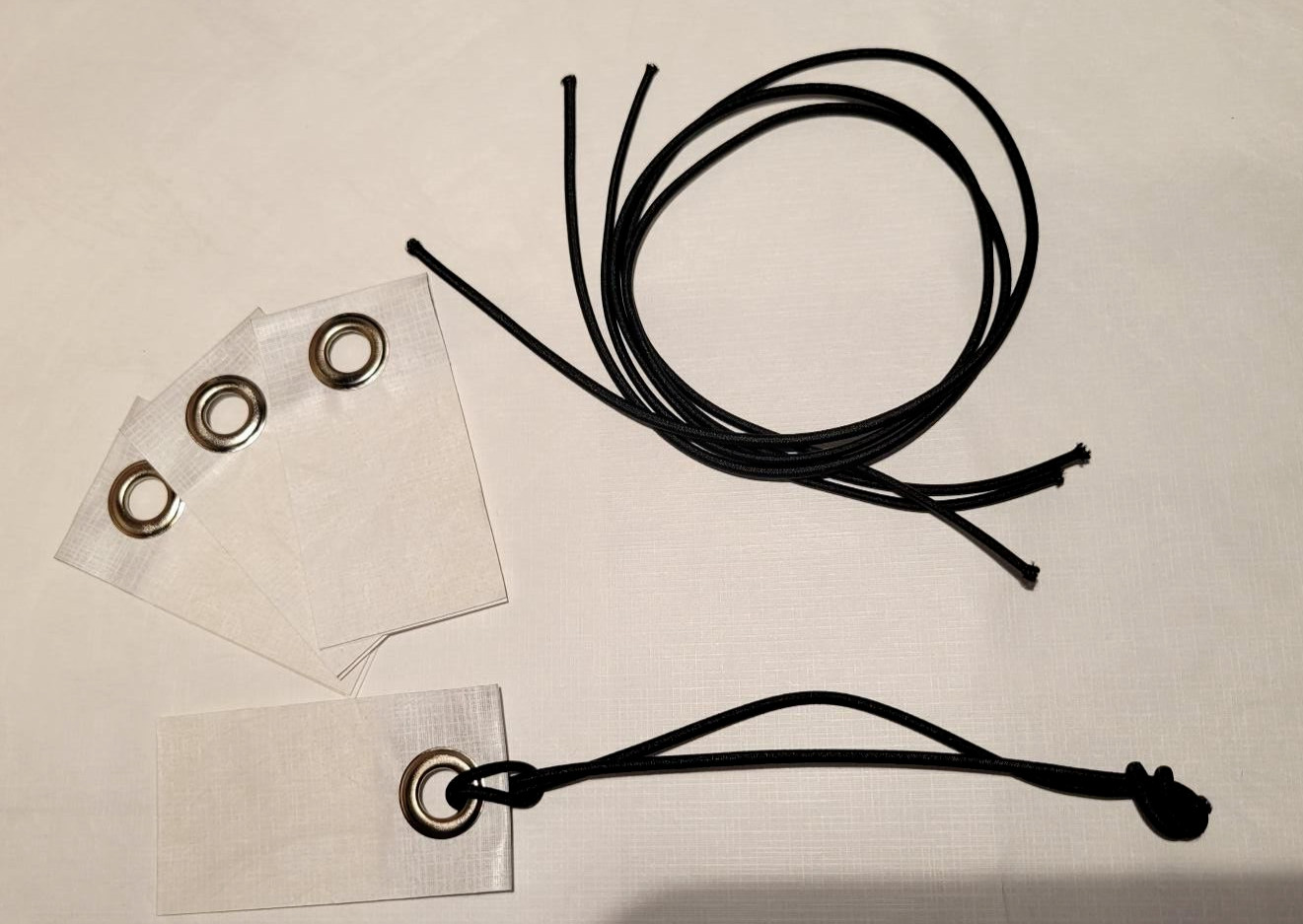 4 – Peel & Stick Grommet Tabs w/ Cords for Tyvek Homewrap Tent Footprint sheets