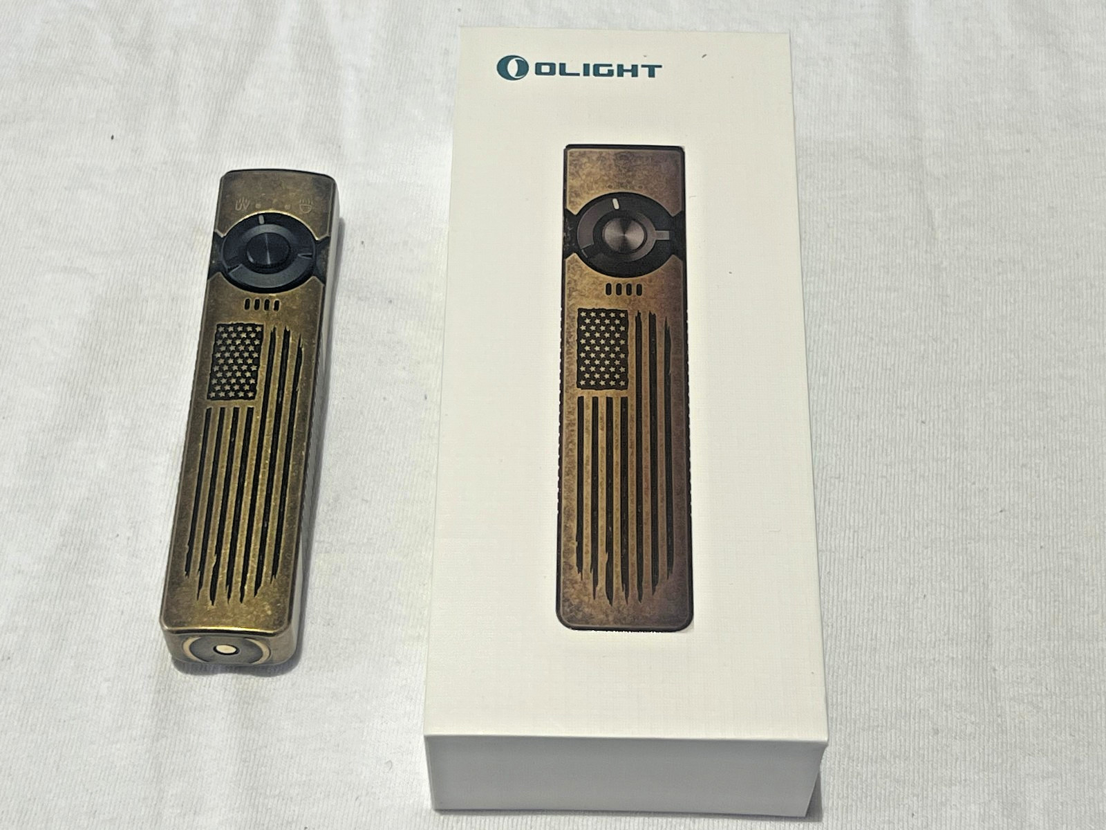 Olight Arkfeld UV Freedom Brass Edition stars and stripes. Patriotic