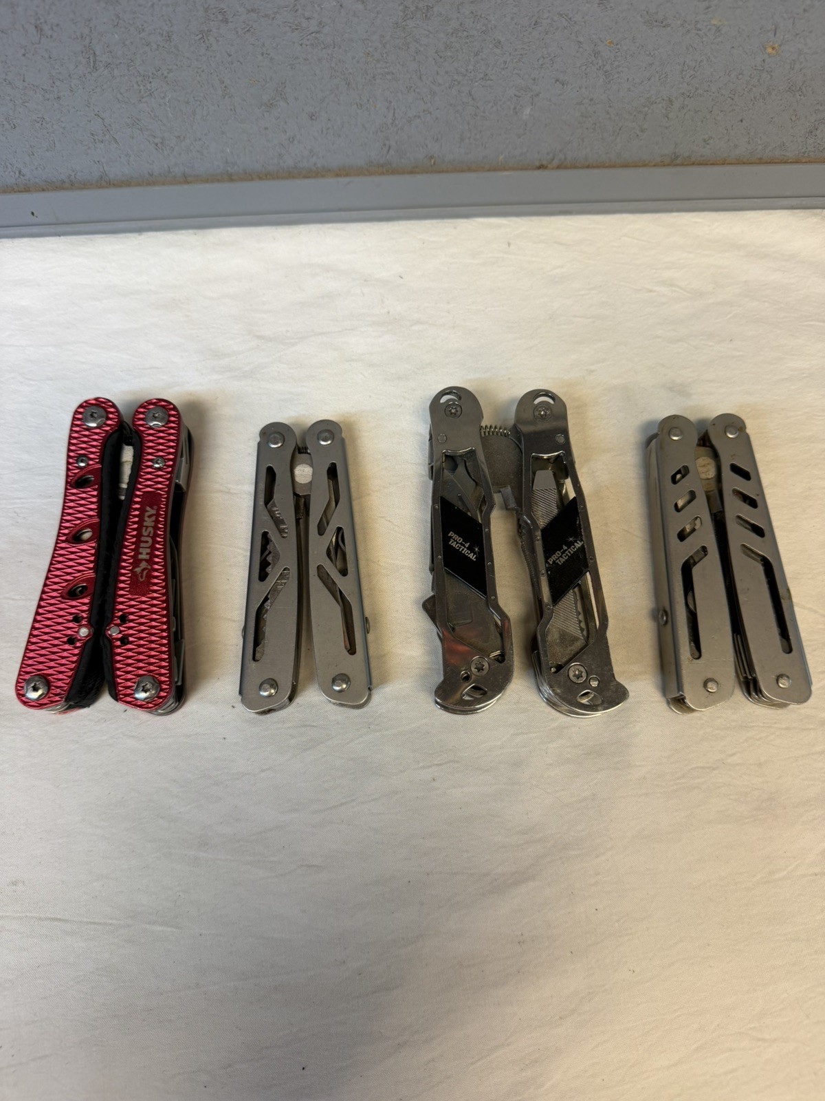 4 Multi-Tools / Pro-4 Tactical, Husky and 2 Unbranded / Good Variety of Tools