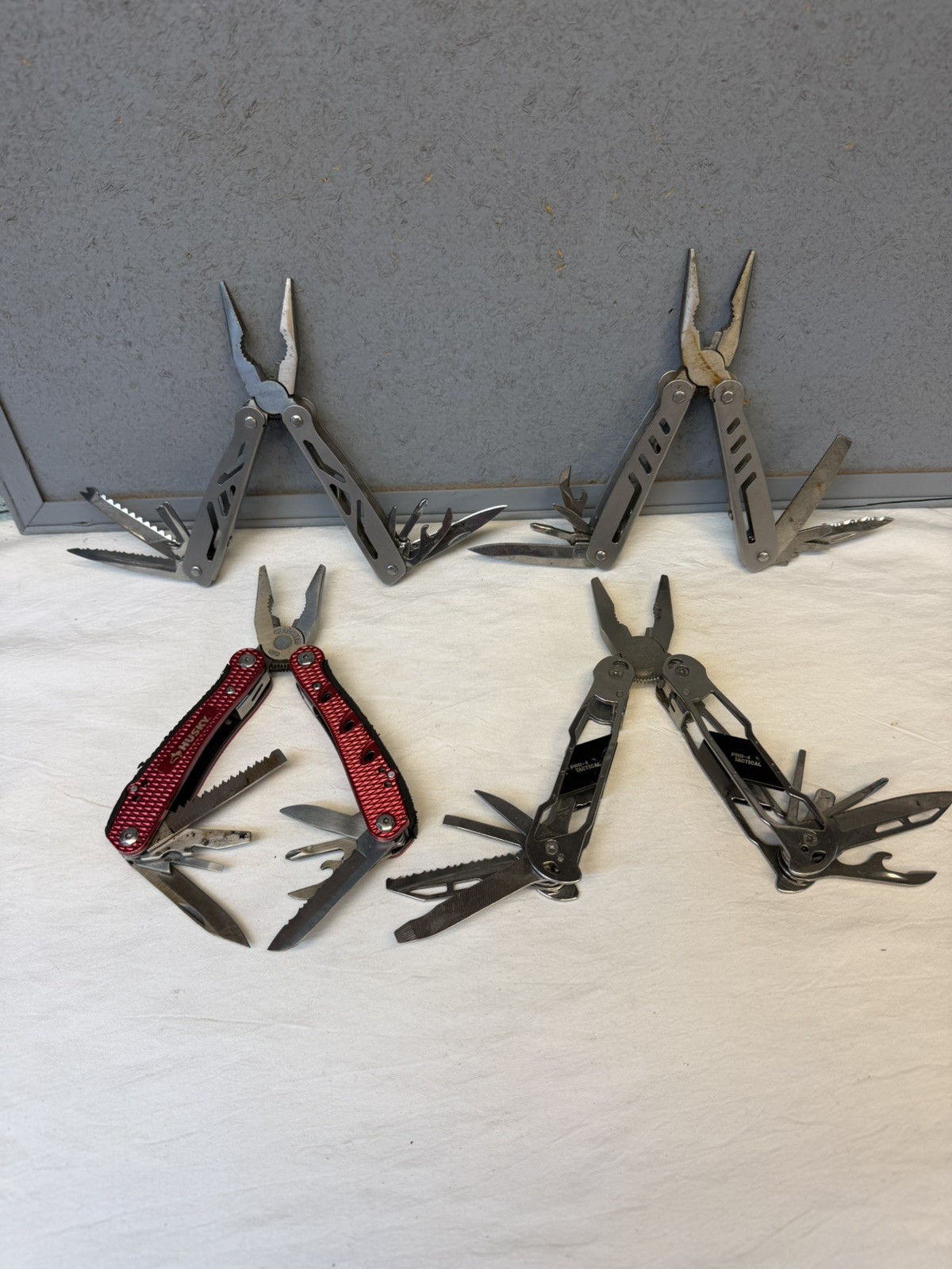 4 Multi-Tools / Pro-4 Tactical, Husky and 2 Unbranded / Good Variety of Tools